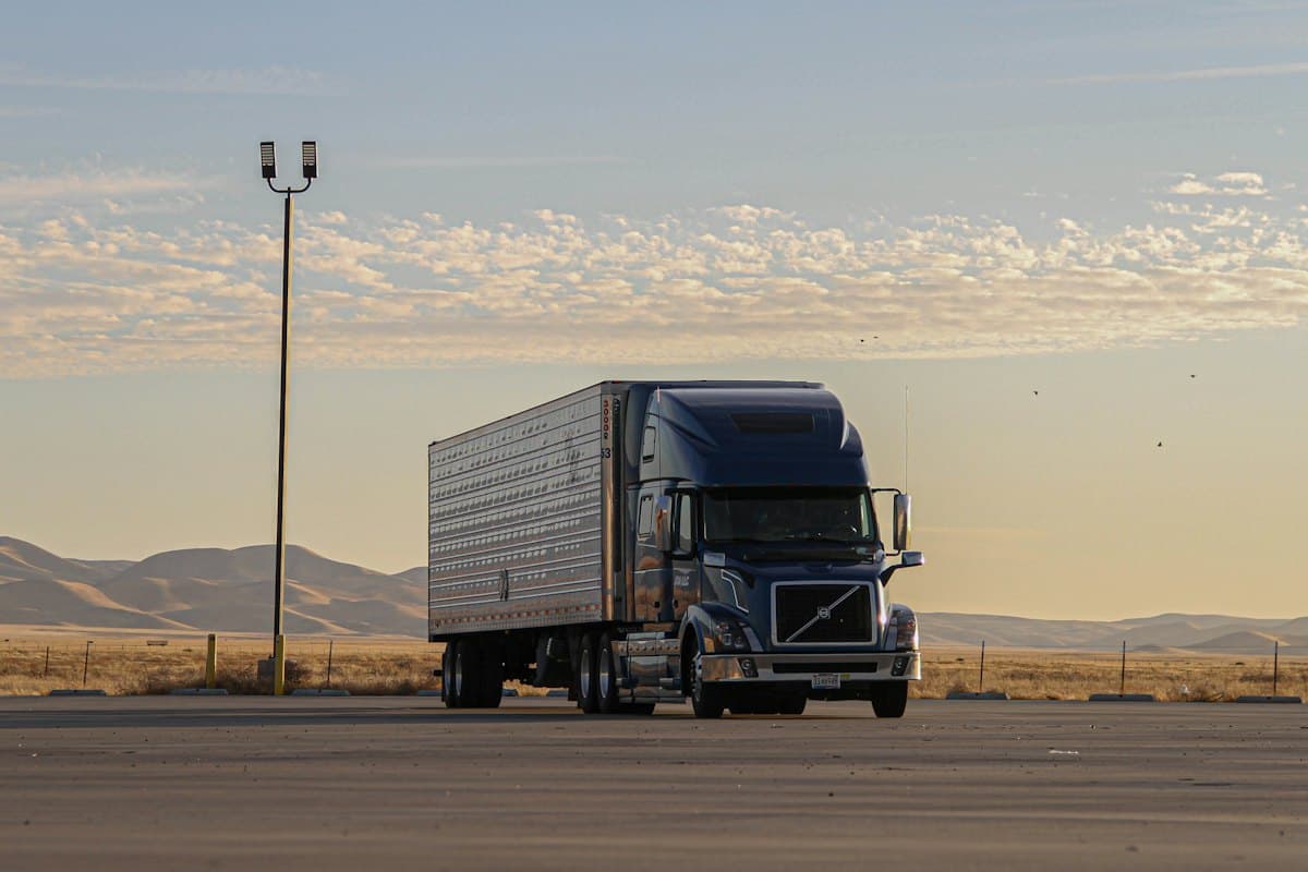 Long-haul lorry with a trailer parked at sunset